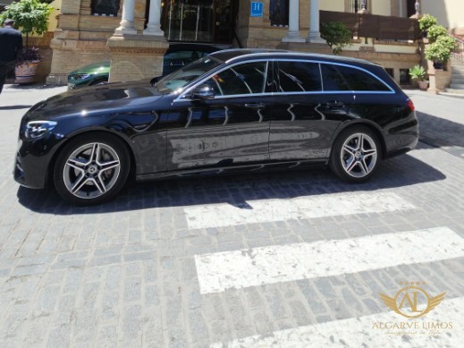 Algarve Limos Mercedes-Benz E-Class estate parked at a historic hotel