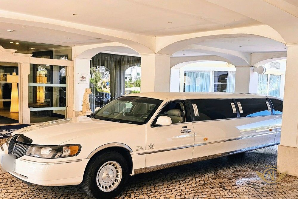 Algarve Limos white Lincoln stretch limousine at a luxury hotel entrance in the Algarve