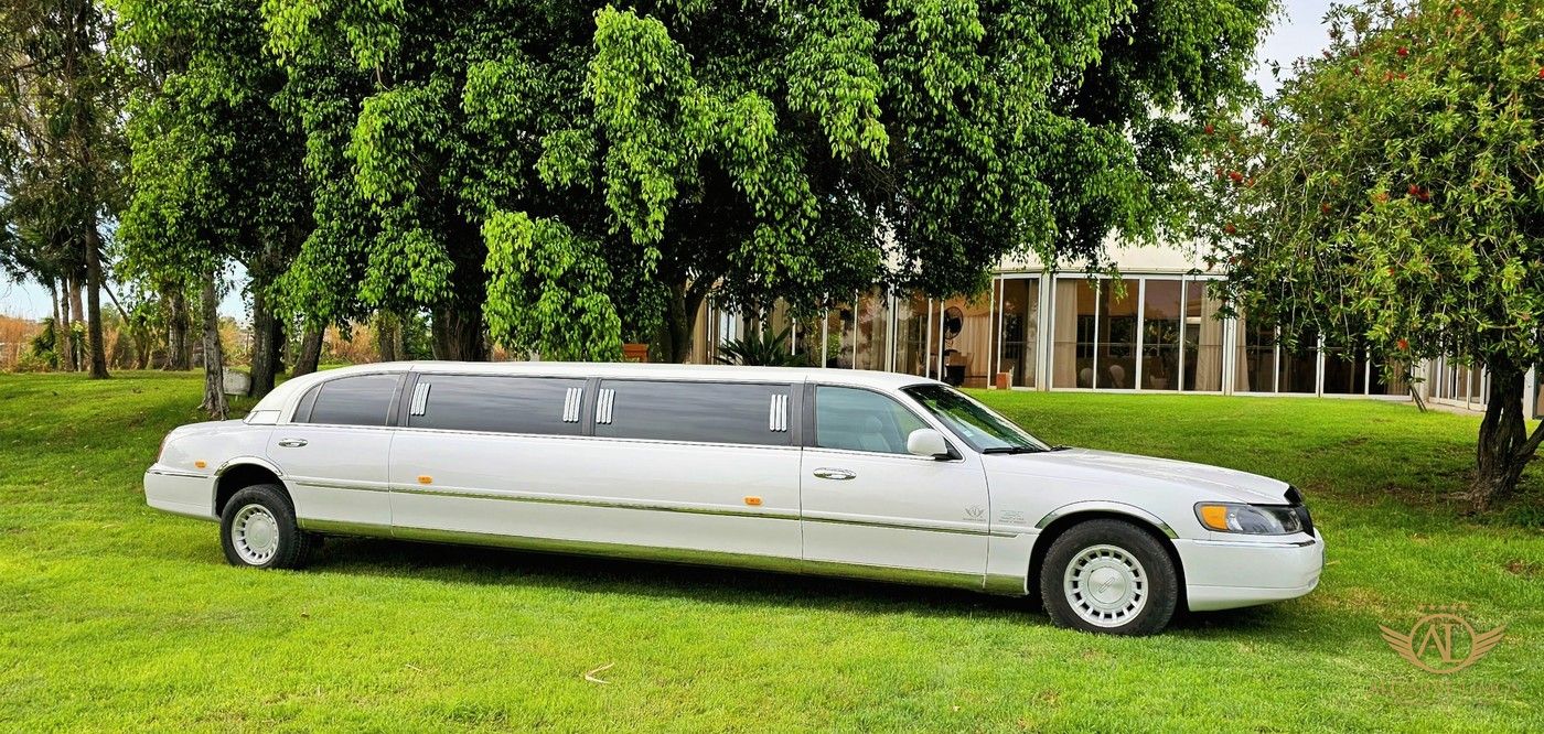 Algarve Limos white stretch limousine on the lawn of a wedding quinta in the Algarve